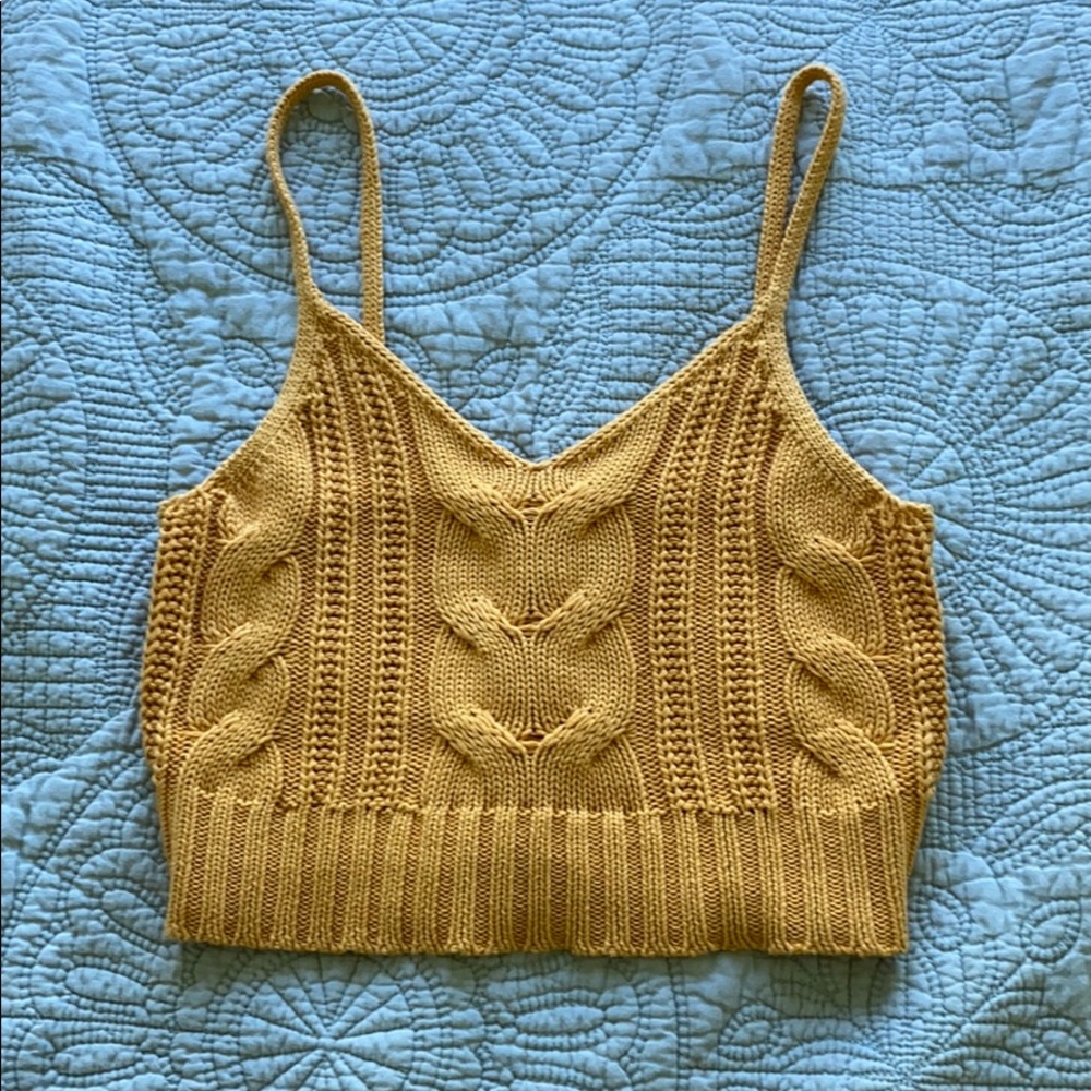 A yellow crocheted tank top